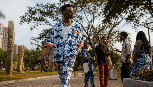 Man wearing Afro-Luxury streetwear in city market