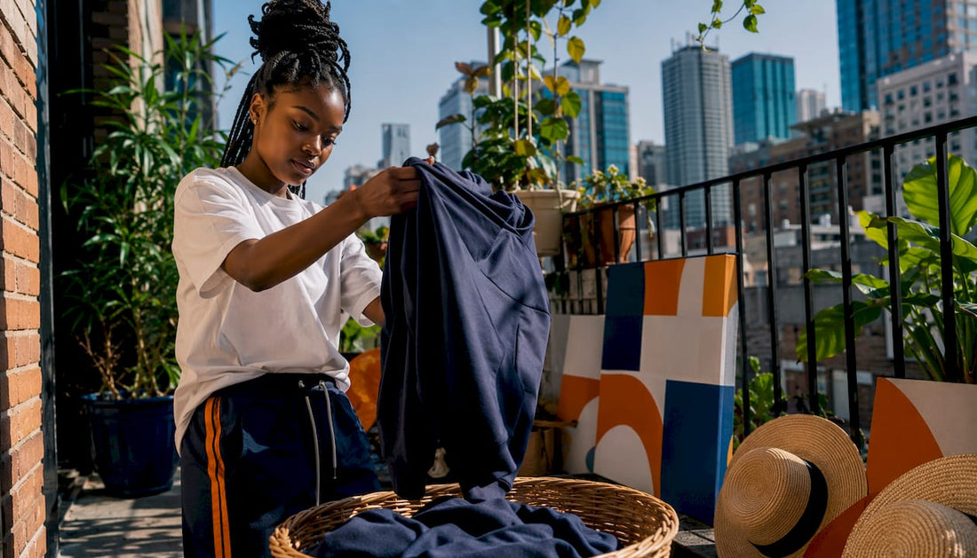 Woman preparing streetwear for laundry wash