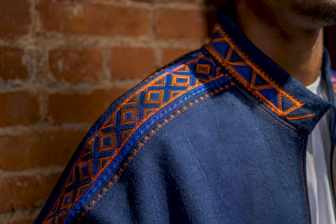 Close-up of Amazigh symbols on streetwear jacket